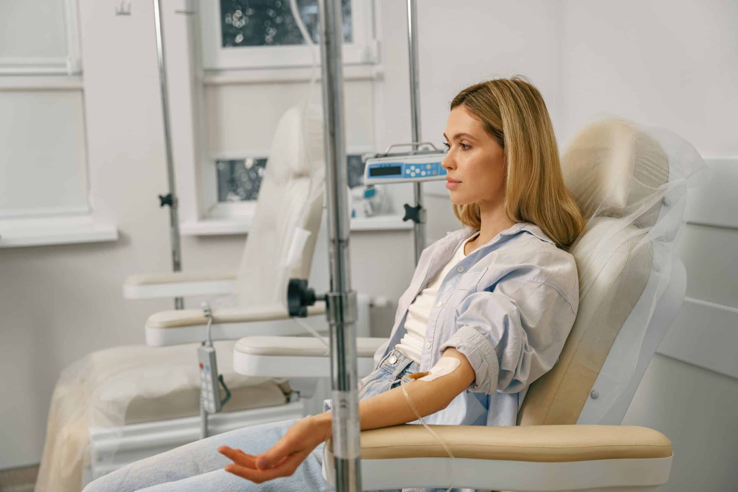 Woman,Sitting,In,Armchair,While,Receiving,Iv,Infusion,In,Hospital. NAD+ IV Therapy